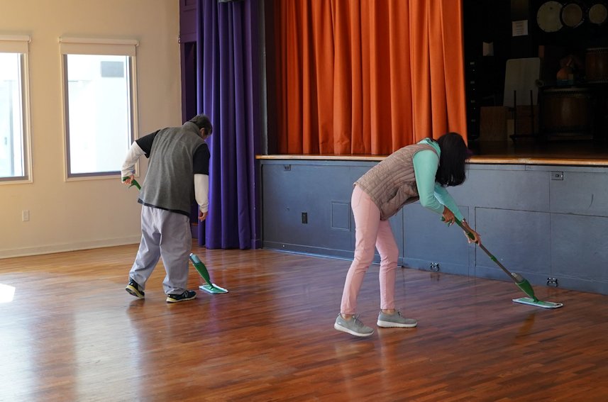 Osoji Temple Cleanup mopping of social hall floor